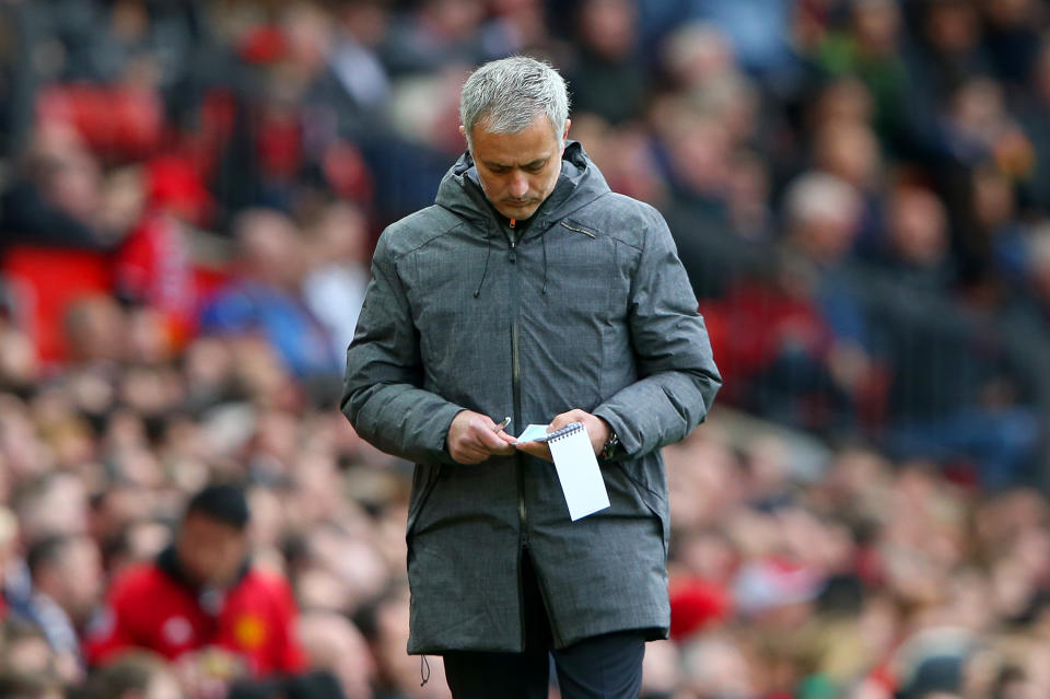 Jose Mourinho uses a notepad to help him manage games.