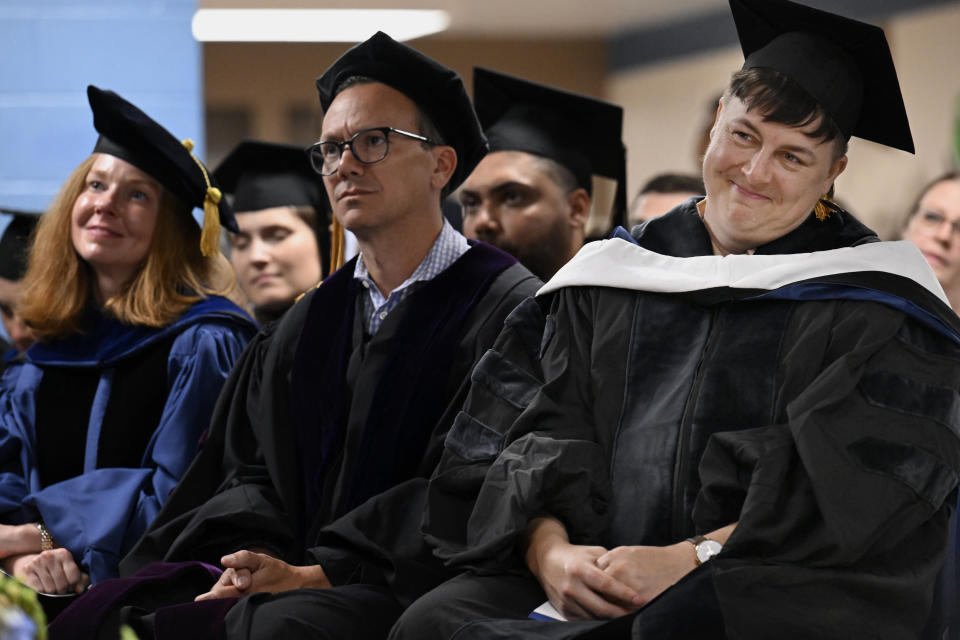 Yale University Associate Professor of American Studies Greta LaFleur, right, reacts as she listens to graduates speak at the first-ever college graduation ceremony at MacDougall-Walker Correctional Institution, Friday, June 9, 2023, in Suffield, Conn. The ceremony was held under a partnership established in 2021 by the University of New Haven and the Yale Prison Education Initiative. (AP Photo/Jessica Hill)