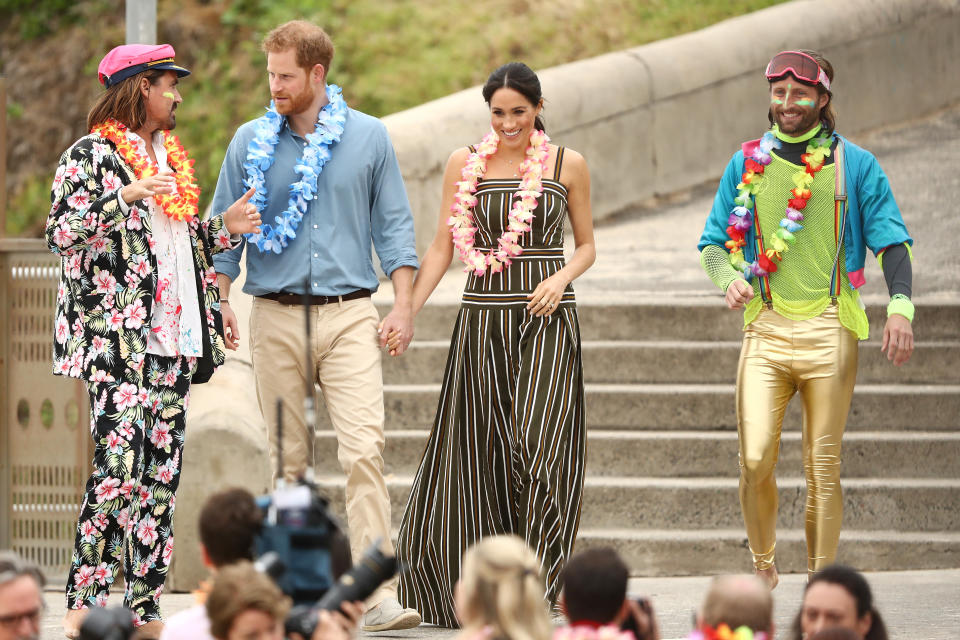 <span><em>One Wave</em> co-founders Grant Trebilco and Sam Schumacher greet the royals. </span>Photo: Getty