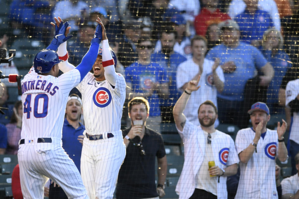 Chicago Cubs' Willson Contreras (40) celebrates with Christopher Morel after Contreras hit a two-run home run against the St. Louis Cardinals during the first inning of a baseball game Thursday, June 2, 2022, in Chicago. (AP Photo/Paul Beaty)