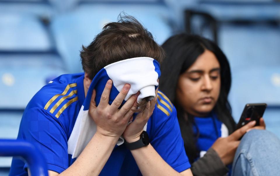 A Leicester City fan looks dejected after their sides defeat, resulting in their relegation to the Championship during the Premier League match between Leicester City and West Ham United at The King Power Stadium on May 28, 2023 - Getty Images/Michael Regan