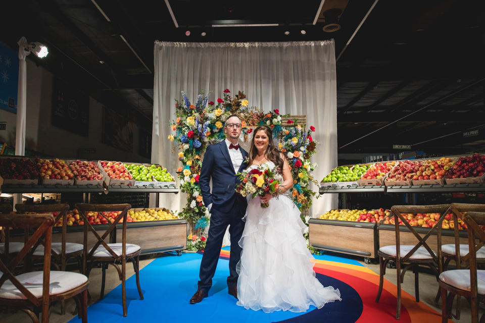 Mike and Jessica Hurd pose in the wedding aisle at their Aldi wedding on Nov. 9 in Batavia, Illinois. (Courtesy Fig Media)