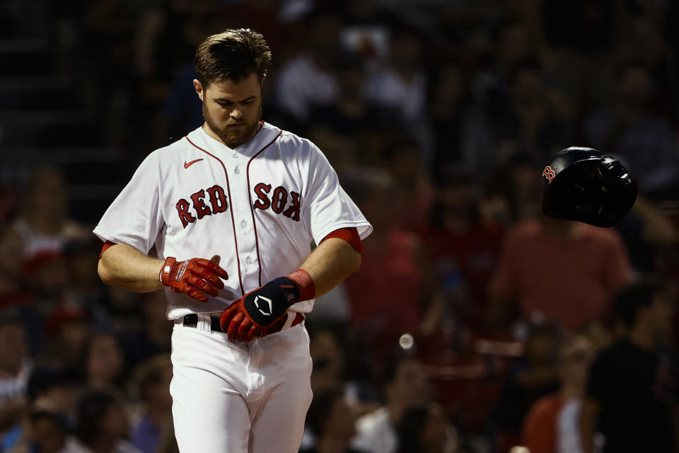 Boston Red Sox's Christian Arroyo tosses his batting helmet after striking out against the Houston Astros during the third inning of a baseball game Tuesday, June 8, 2021, at Fenway Park in Boston. (AP Photo/Winslow Townson)