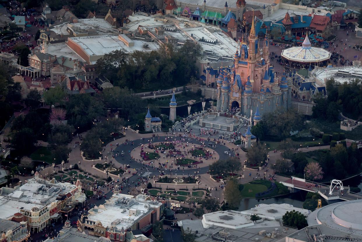 In an aerial view, Walt Disney World's iconic Cinderella Castle sits on the grounds of the theme park on February 08, 2023 in Orlando, Florida. As Florida Gov. Ron DeSantis continues his push to punish Walt Disney Co. by taking control of the board of Disney's special taxing district, the company announced today a restructuring. As a result, Disney expects to cut costs by $5.5 billion and lay off roughly 7,000 employees, or about 4 percent of its global workforce.