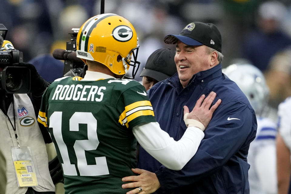 GREEN BAY, WISCONSIN - NOVEMBER 13: Aaron Rodgers #12 of the Green Bay Packers talks to head coach Mike McCarthy of the Dallas Cowboys during pregame at Lambeau Field on November 13, 2022 in Green Bay, Wisconsin. (Photo by Patrick McDermott/Getty Images)