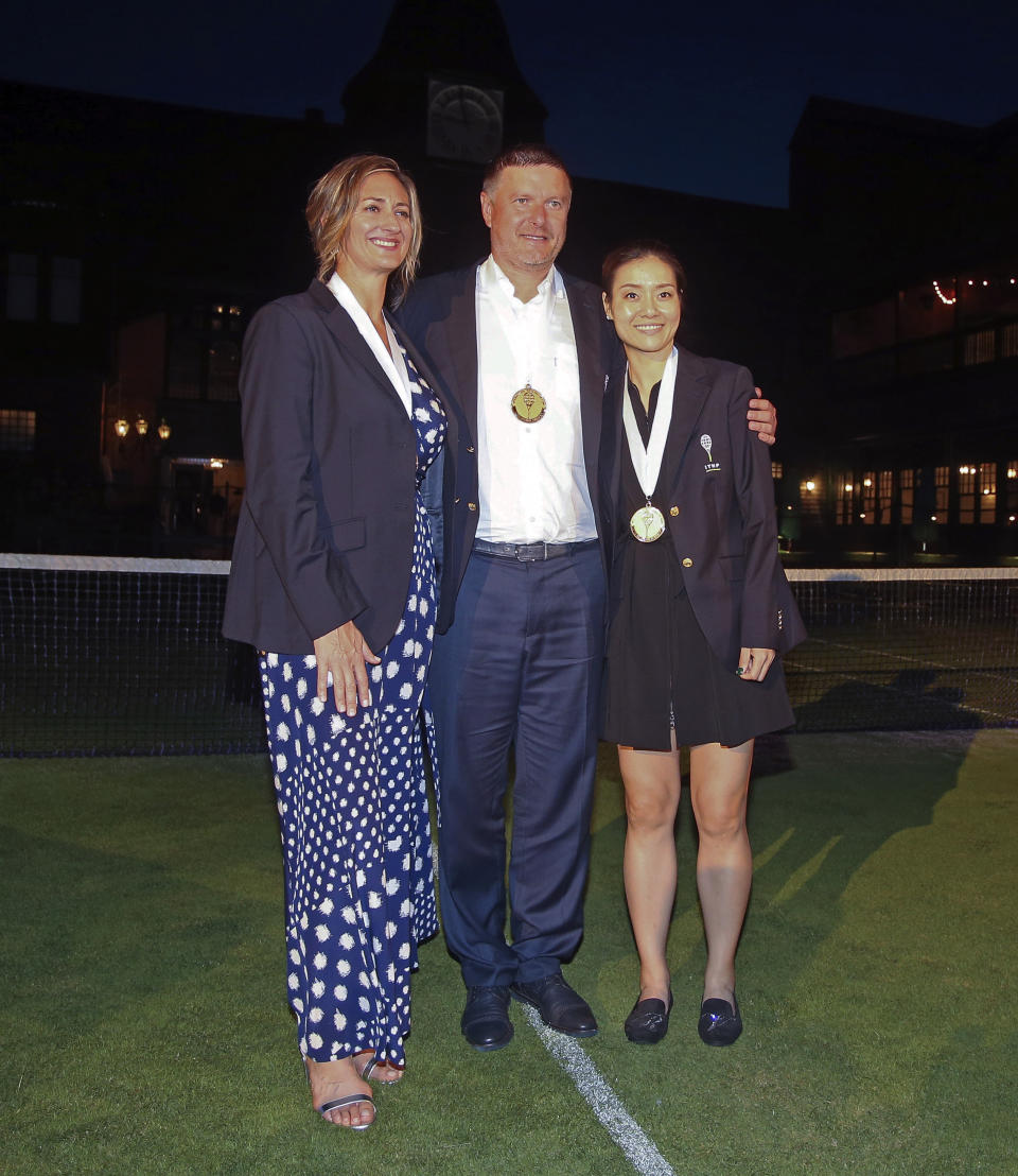 Tennis Hall of Fame inductees, from left, Mary Pierce of France, Yevgeny Kafelnikov of Russia and Li Na of China pose for photos following induction ceremonies at the International Tennis Hall of Fame, Saturday, July 20, 2019, in Newport, R.I. (AP Photo/Stew Milne)