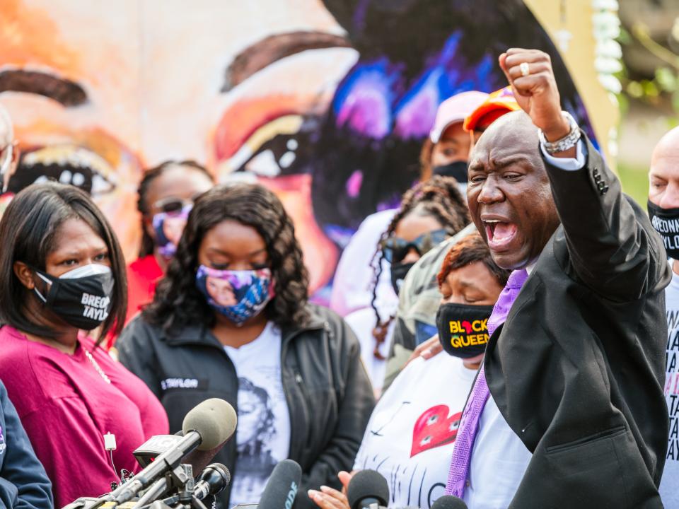 Attorney Ben Crump leads a chant during a press conference for the Breonna Taylor case.