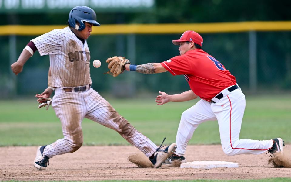 COTUIT    07/25/22    Caleb Lomavita of Cotuit jumps back to second ahead of the throw to Zack Lew of Y-Dfor a gallery: https://www.capecodtimes.com/news/photo-galleries/