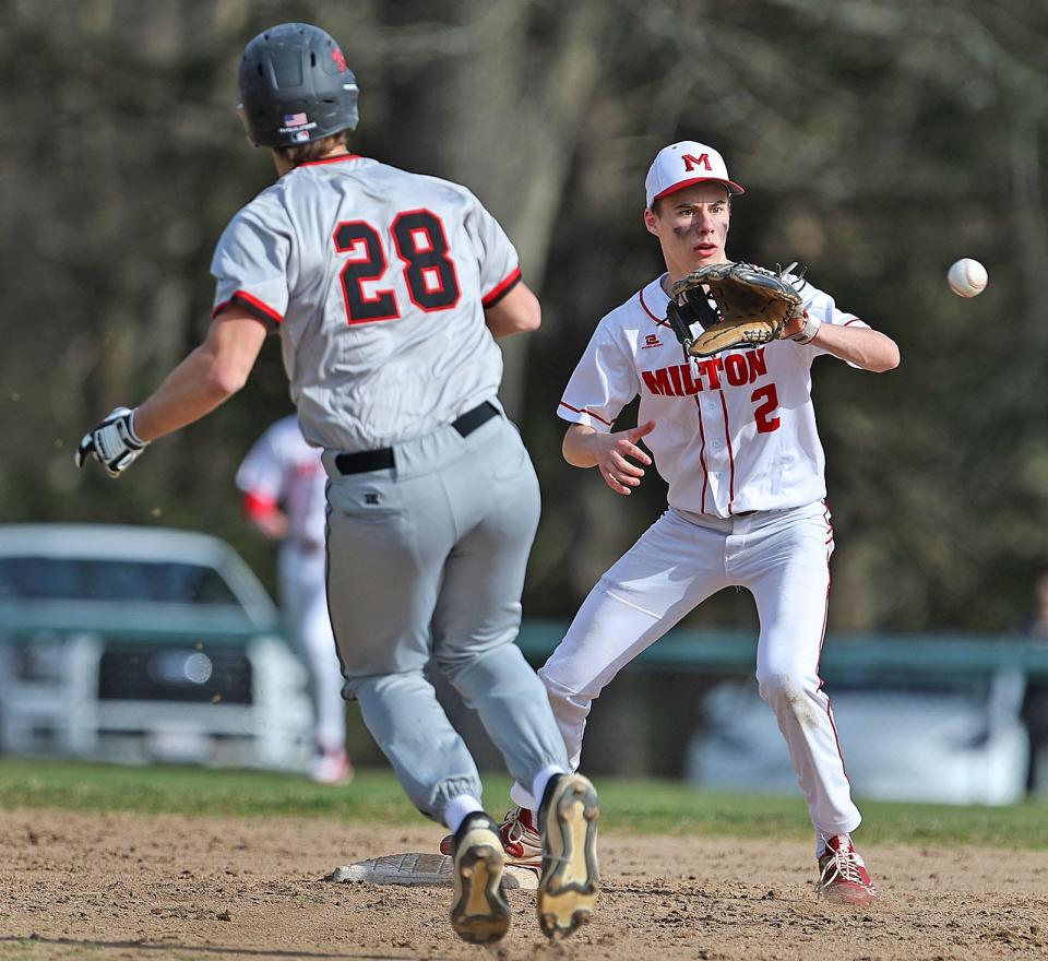 Shortstop Luke Naughton forces Wellesley's Teddy Griswold out at second base. Milton baseball hosts Wellesley at Cunningham Field on Monday April 8, 2024