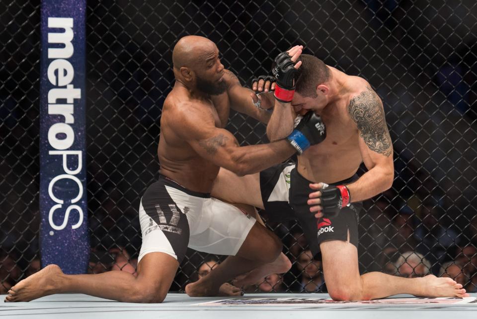 <p>(L-R) Yoel Romero of Cuba punches Chris Weidman in their middleweight fight during the UFC 205 event at Madison Square Garden on November 12, 2016 in New York City. (Photo by Brandon Magnus/Zuffa LLC/Zuffa LLC via Getty Images) </p>