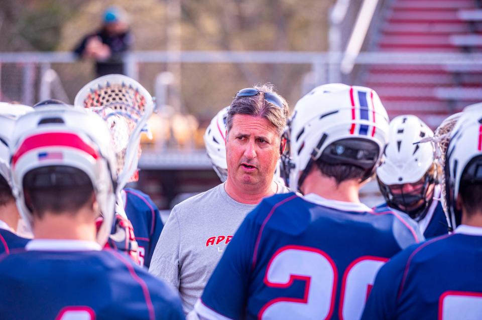 Apponequet coach Jeremy Nodelman speaks to the team during a timeout.