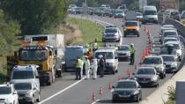 Police prepare to tow a refrigerated truck from a highway near Neusiedl am See, Austria, on August 27, 2015, following the grim discovery of 71 bodies