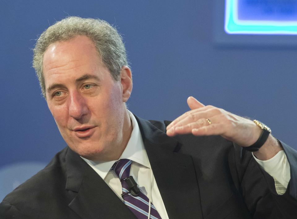 U.S. Trade Representative Michael Froman, right, gestures as he talks with EU Trade Commissioner Karel De Gucht, prior to a session at the World Economic Forum in Davos, Switzerland, Saturday, Jan. 25, 2014. Global leaders argued Friday that efforts to eradicate poverty must be linked to climate change, saying that rising temperatures will have widespread effects on everything from food supplies to education. (AP Photo/Michel Euler)