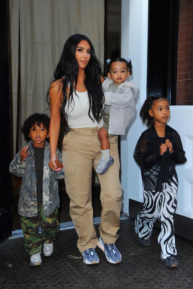 A mundanely familiar existence, performed for a global audience ... Kardashian West with her children.