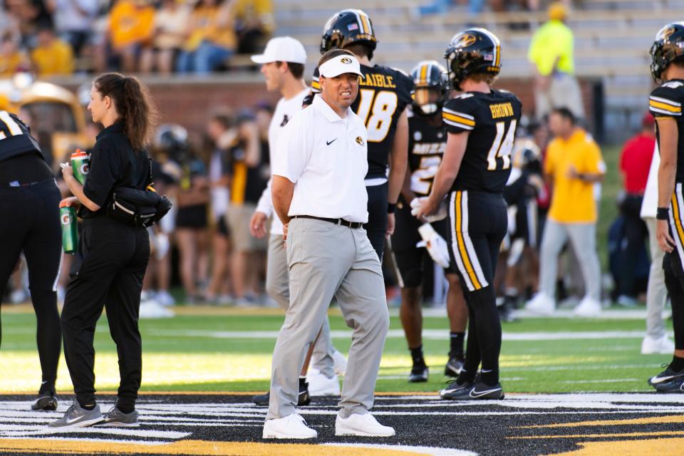 Missouri head coach Eliah Drinkwitz watches as players warm up before an NCAA college football game against South Dakota, Thursday, Aug. 31, 2023, in Columbia, Mo.