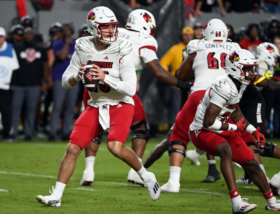 Sep 29, 2023; Raleigh, North Carolina, USA; Louisville Cardinals quarterback Jack Plummer (13) looks to pass during the first half against the North Carolina State Wolfpack at Carter-Finley Stadium. Mandatory Credit: Rob Kinnan-USA TODAY Sports