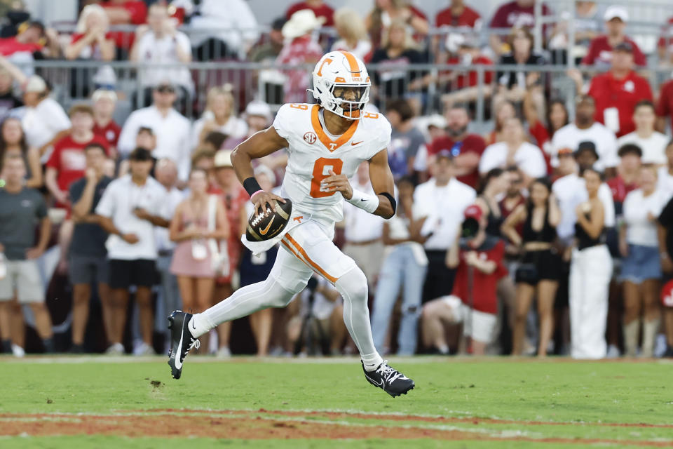 Tennessee quarterback Nico Iamaleava (8) runs the ball against Oklahoma during the first quarter of an NCAA college football game, Saturday, Sept. 21, 2024, in Norman, Okla. (AP Photo/Alonzo Adams)