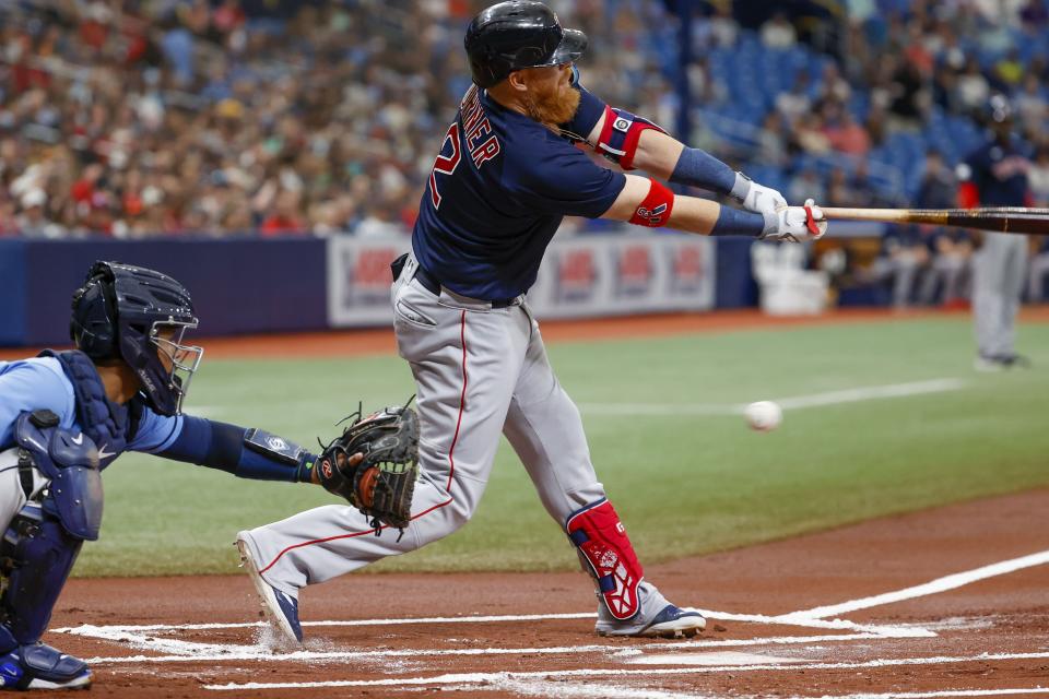 Boston Red Sox designated hitter Justin Turner (2) strikes out swinging in the first inning of a baseball game against the Tampa Bay Rays at Tropicana Field in St. Petersburg, Fla., Thursday, April 13, 2023. (Ivy/Tampa Bay Times via AP)