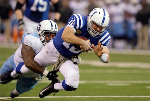 Indianapolis Colts quarterback Andrew Luck (12) is tackled by Tennessee Titans defensive tackle Jurrell Casey during the first half of an NFL football game in Indianapolis - Credit: AP Photo/Darron Cummings