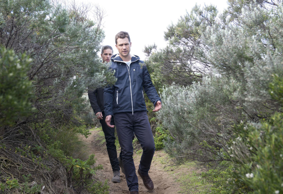 Tuesday, November 28: Tyler and Mark look through the bushland where Piper was rescued