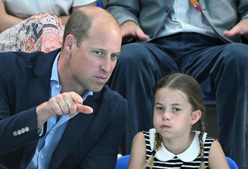 Princess Charlotte of Cambridge and Prince William, Duke of Cambridge watch the men’s 1500m freestyle heats swimming event at the Sandwell Aquatics Centre (AFP via Getty Images)