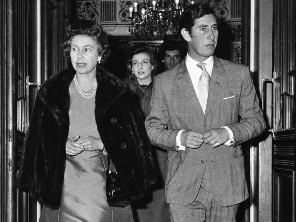 Queen Elizabeth II and Prince Charles, followed by Princess Alexandra, leave the Vaudeville Theater in London, after attending a performance of Alan Ayckbourn's play &quot;Absurd Person Singular&quot;, Nov. 14, 1974. It is Prince Charles 26th birthday.