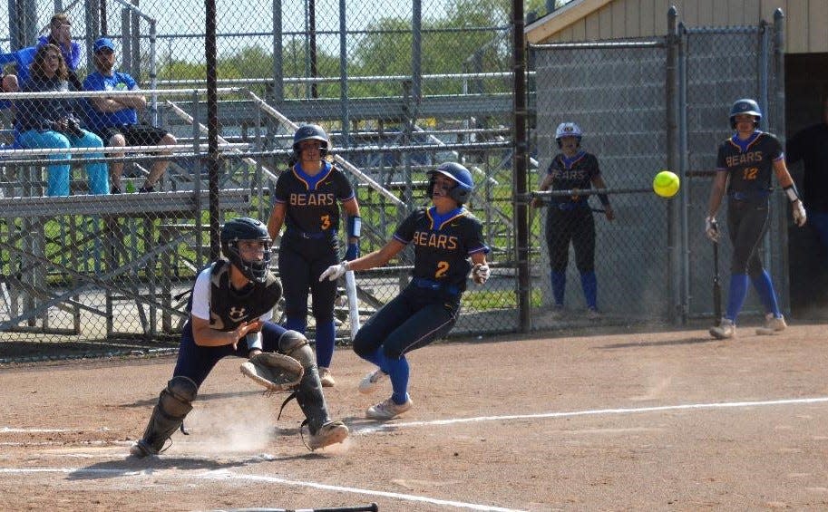 Emmi Liptow scores a run for Jefferson Monday as Airport catcher Peyton Zajac waits for a throw from rightfield.