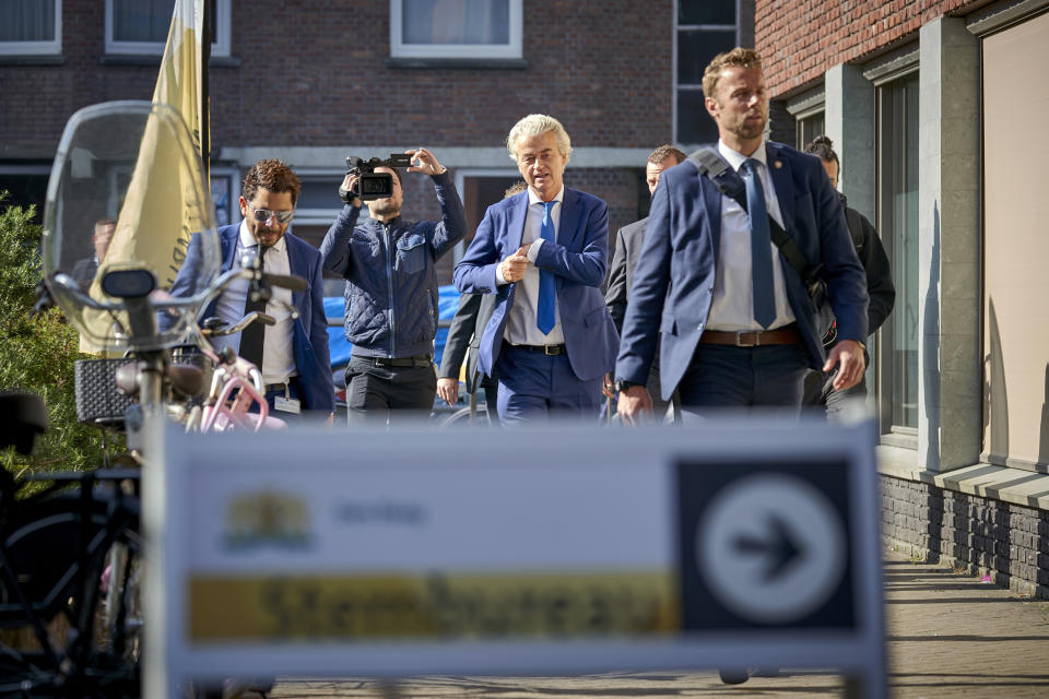 Geert Wilders, leader of the Dutch Party for Freedom, center, arrives at a polling station to cast his vote in the European elections in The Hague, Netherlands, Thursday, May 23, 2019. (AP Photo/Phil Nijhuis)