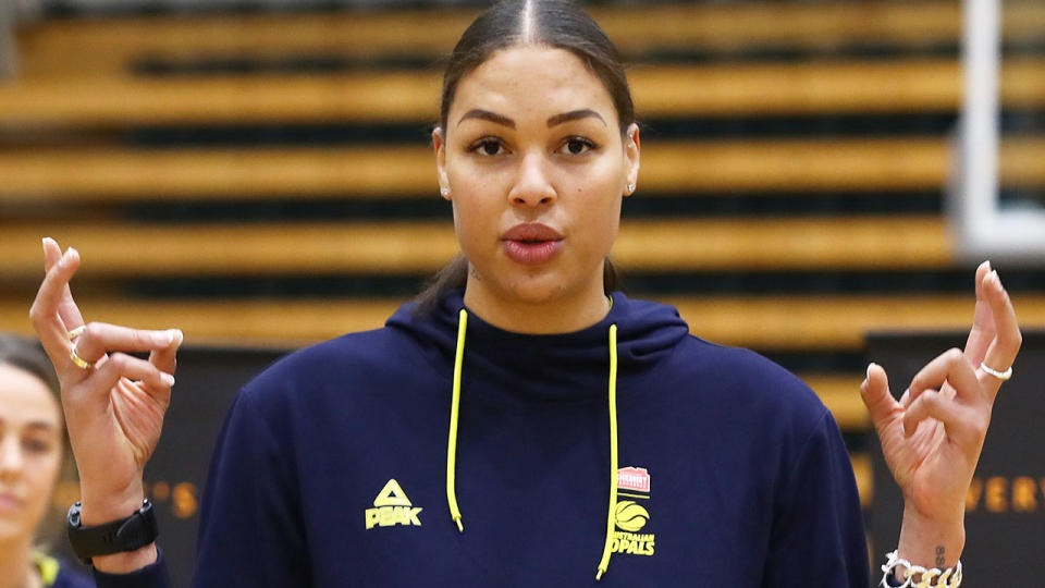 In this photo, Australian Olympic basketball star Liz Cambage chats to the media.