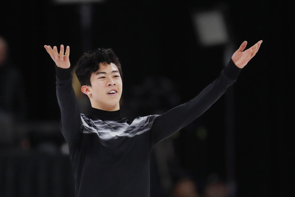 FILE - In this Jan. 27, 2019, file photo, Nathan Chen acknowledges the audience after performing the men's free skate at the U.S. Figure Skating Championships in Detroit. Defending champion Nathan Chen heads to the world figure skating championships in Japan balancing the rigors of competition with the scholastic requirements of being an undergraduate at Yale. (AP Photo/Paul Sancya, File)
