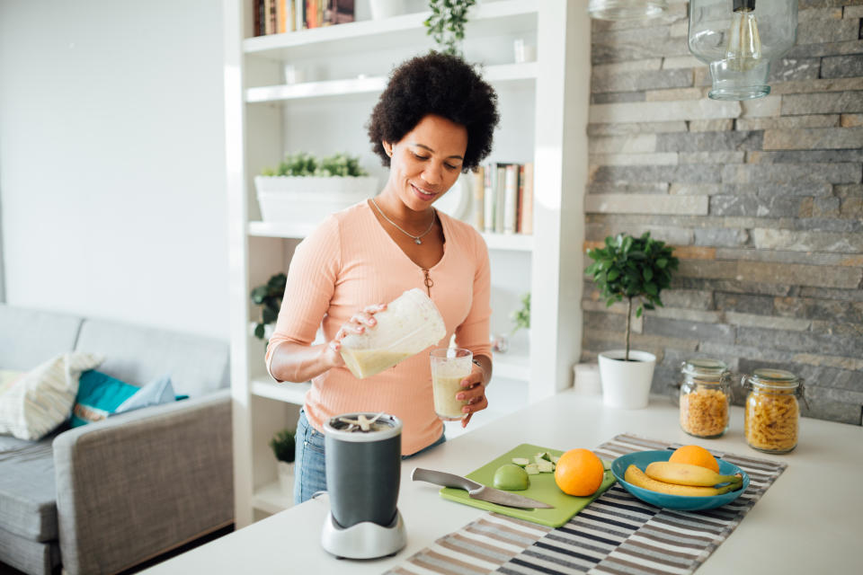 Woman making a healthy breakfast. (Getty Images)