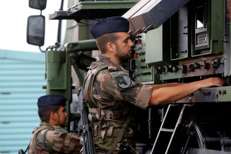 French soldiers work in weapon systems during the exercise 'Aurora 17' at Save airfield in Goteborg, Sweden. Henrik Brunnsgard/TT News Agency/via REUTERS