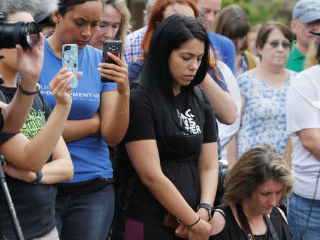 Participants of "Charlottesville to D.C: The March to Confront White Supremacy" pray before a ten-day trek to the nation's capital from Charlottesville, Virginia, U.S. August 28, 2017. REUTERS/Julia Rendleman