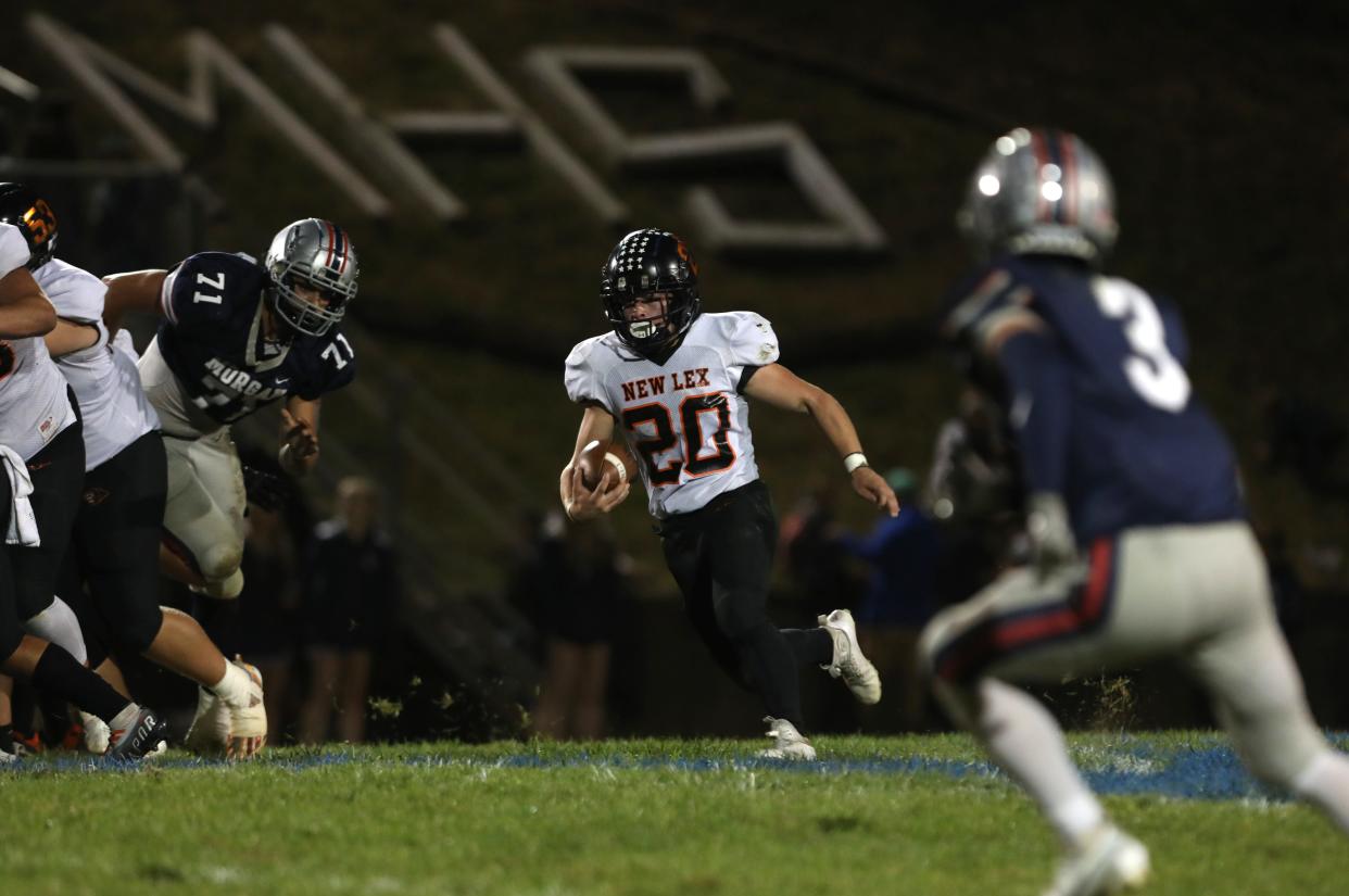 New Lexington's Hunter Rose carries the ball against Morgan.