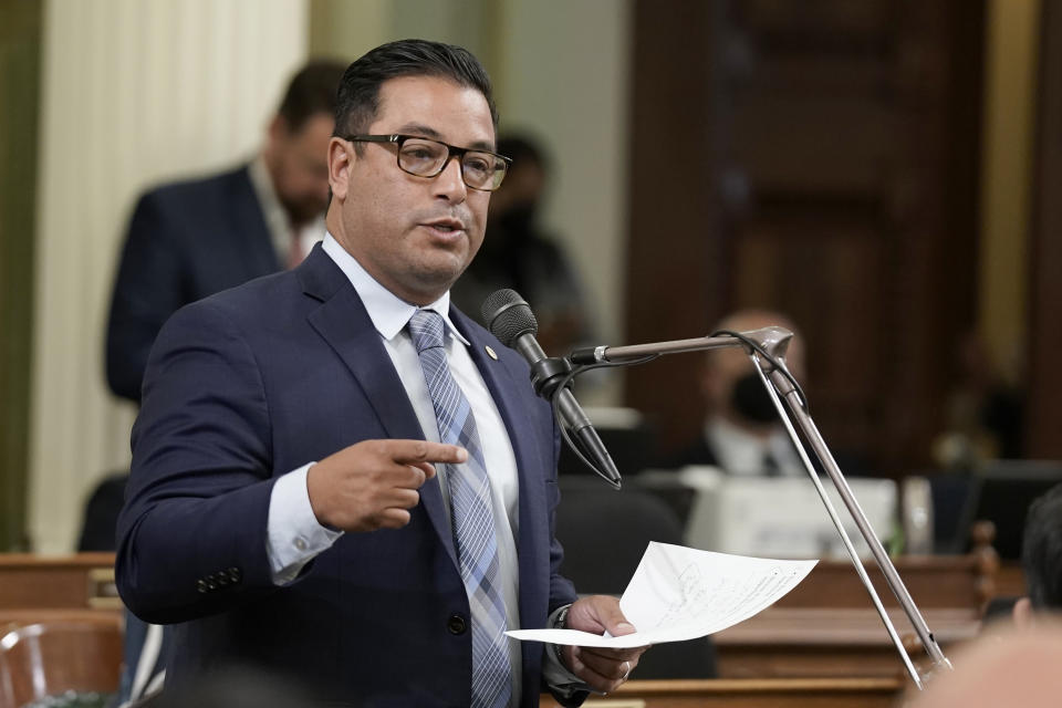 Assemblyman Carlos Villapudua, D-Stockton, talks about the death of his brother due to complications from drug abuse as he calls on lawmakers to reject a measure to allow Los Angeles, Oakland and San Francisco to set up places where opioid users could legally inject drugs in supervised settings, during the Assembly session in Sacramento, Calif., on Thursday, June 30, 2022. The Assembly approved the measure and sent it back to the Senate for final consideration. (AP Photo/Rich Pedroncelli)