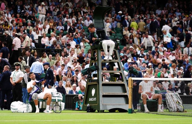 Novak Djokovic speaks to the umpire