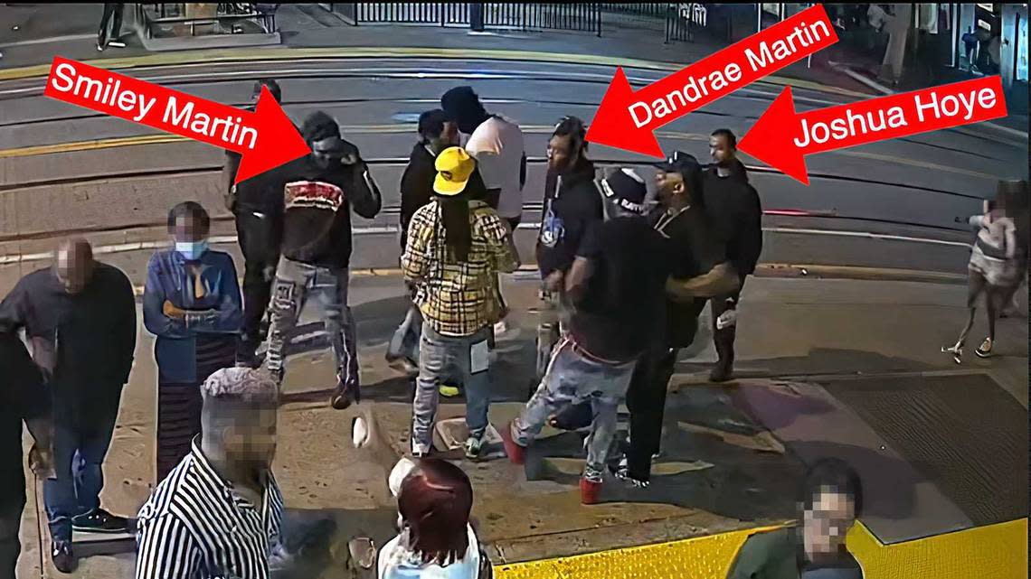 In an image captured from surveillance video and labeled by Sacramento police, gang members are identified moments before a shooting April 3, 2022, in downtown Sacramento. Six people were killed and 12 others were wounded in the shootout. Prosecutors on Tuesday charged Deandrae and Smiley Martin and Mtula Payton with the murders of three women killed in the gunfight. Sacramento Police Department