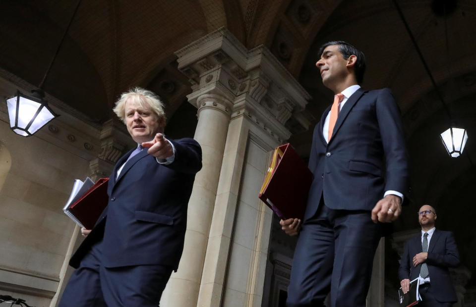 Britain's Prime Minister Boris Johnson and Chancellor of the Exchequer Rishi Sunak arrive for a Cabinet meeting, in London, Britain October 13, 2020. REUTERS/Simon Dawson