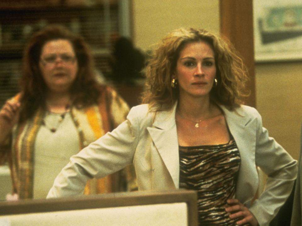 Julia Roberts as Erin Brockovich wearing an animal print shirt with blazer