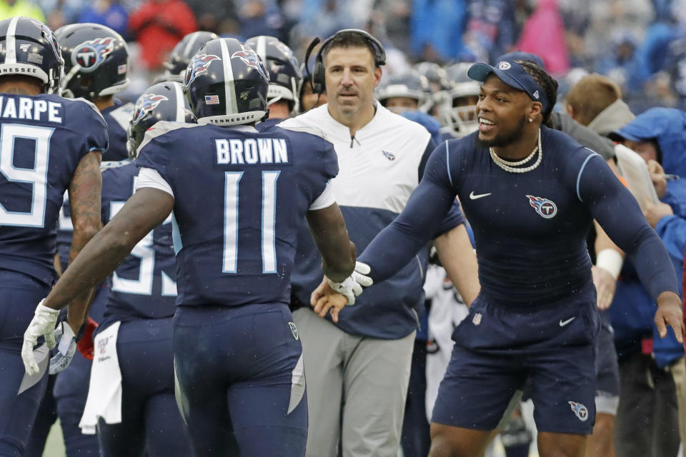 Tennessee Titans wide receiver A.J. Brown (11) is congratulated by running back Derrick Henry, right, after Brown scored a touchdown on a 49-yard run against the New Orleans Saints in the first half of an NFL football game Sunday, Dec. 22, 2019, in Nashville, Tenn. (AP Photo/James Kenney)