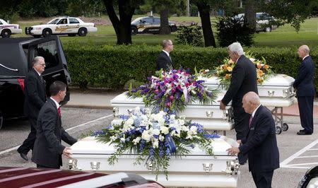 Three caskets are lined up to be put into hearses after the funeral service for members of the Stay family at the Church of Jesus Christ of Latter-Day Saints in Spring, Texas July 16, 2014. REUTERS/Daniel Kramer