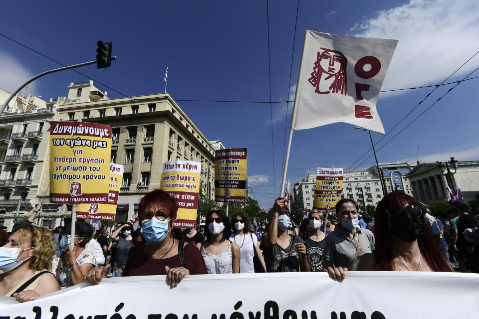 Protesters march to the parliament during a 24-hour labor strike in Athens, Thursday, June 10, 2021. Widespread strikes in Greece brought public transport and other services to a halt Thursday, as the country's largest labor unions protested against employment reforms they argue will make flexible workplace changes introduced during the pandemic more permanent. (AP Photo/Michael Varaklas)