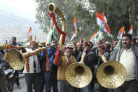 Congress party workers celebrate the party's lead in Himachal Pradesh state elections in Kullu, India, Thursday, Dec.8, 2022. (AP Photo/Aqil Khan)
