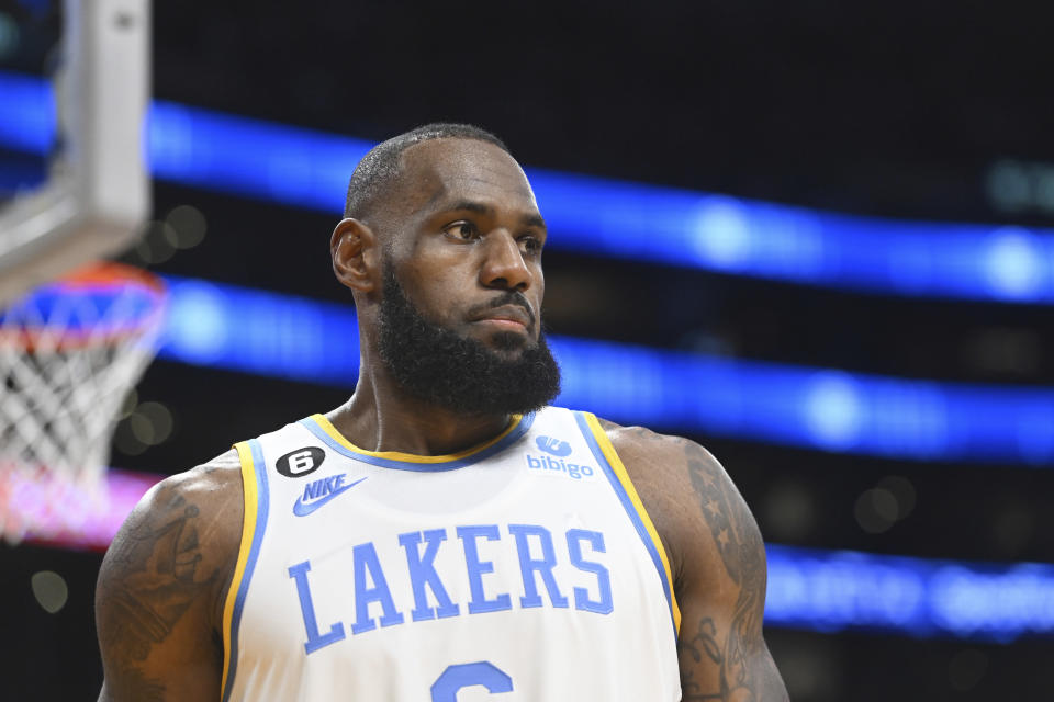 Los Angeles Lakers forward LeBron James looks on during an NBA basketball game against the Denver Nuggets, Oct. 30, 2022, in Los Angeles. Much like many of Twitter's hundreds of millions of users, professional sports stars are also dealing with the chaos and uncertainty surrounding the microblogging app since Elon Musk took it over and began trimming the staff and making other changes. Even the people paid to advise the athletes are not necessarily sure how to proceed as Twitter evolves — or maybe goes away entirely. (AP Photo/Michael Owen Baker)