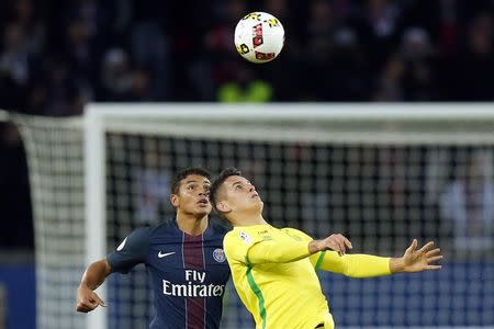 Football Soccer - Paris St Germain v Nantes French Ligue 1 - Parc des Princes, Paris, France - 19/11/16. Paris St Germain's Thiago Silva (L) challenges Nantes' Mariusz Stepinski. REUTERS/Gonzalo Fuentes