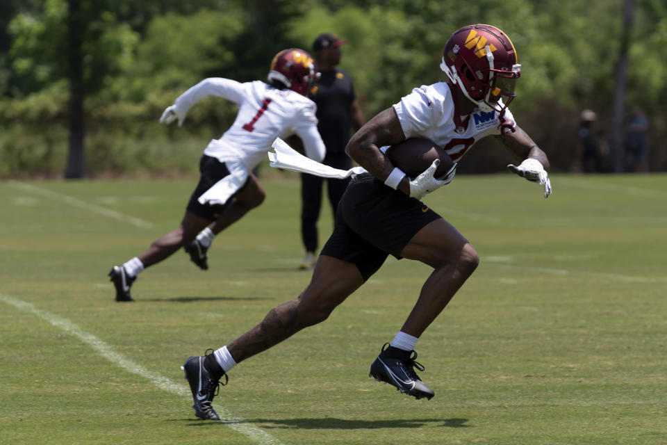 Washington Commanders wide receiver Dyami Brown runs during NFL football practice in Ashburn, Va., Wednesday, May 22, 2024. (AP Photo/Jose Luis Magana)