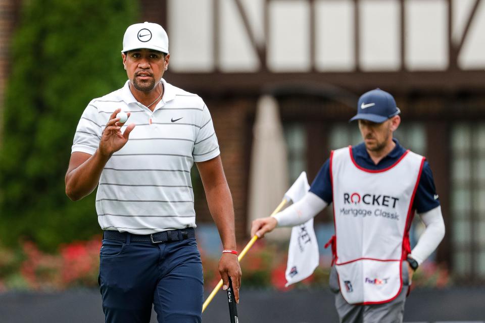 Tony Finau waves at fans as he walks towards 8th tee box during Round 1 of the Rocket Mortgage Classic at the Detroit Golf Club in Detroit on Thursday, July 28, 2022.