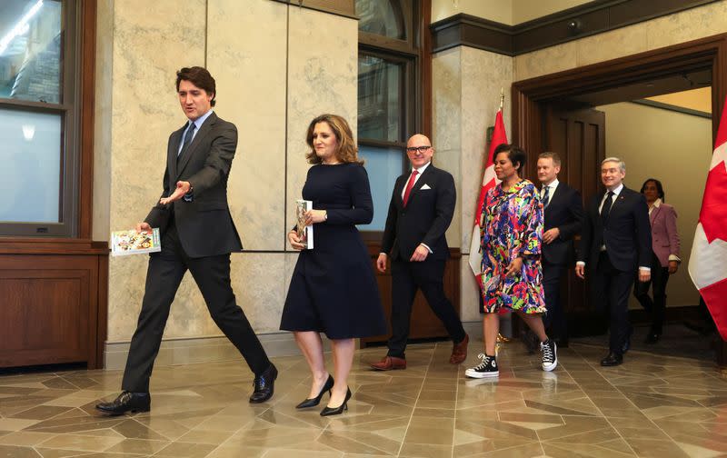 Canada's Prime Minister Justin Trudeau and Finance Minister Chrystia Freeland pose for a picture holding the 2024-25 budget in Ottawa