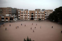 Boys play football in the yard of The al-Shawkani Foundation for Orphans Care in Sanaa, Yemen, January 24, 2017. REUTERS/Khaled Abdullah