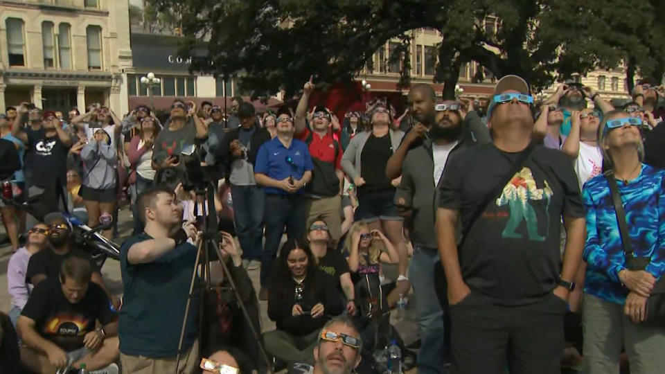 A crowd views the partial solar eclipse at the Alamo in San Antonio, Texas. Oct. 14, 2023.  / Credit: CBS News
